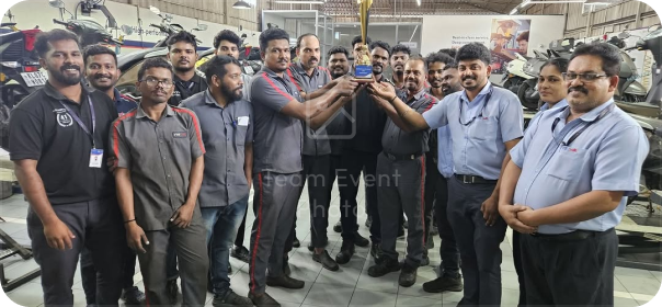 RAJ TVS workshop team with trophy